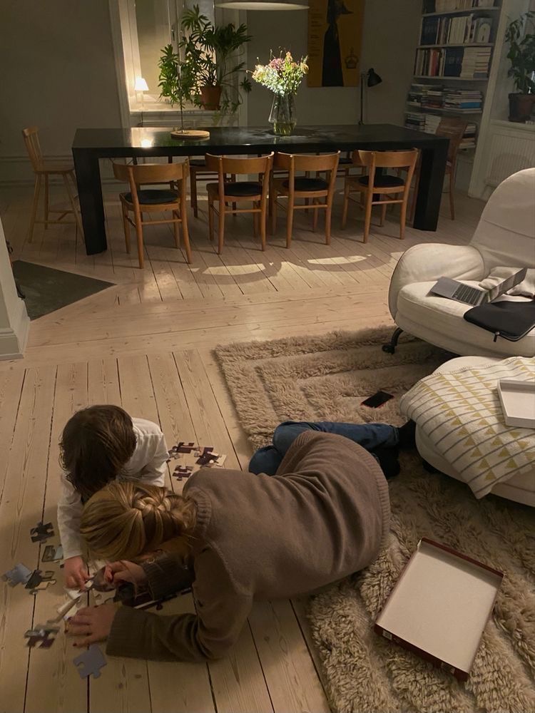 Children playing with puzzle in a cozy Scandinavian family living room